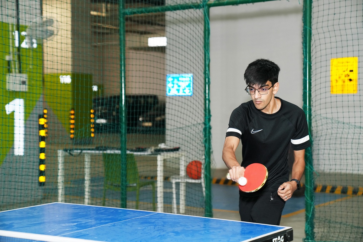 A student playing table tennis